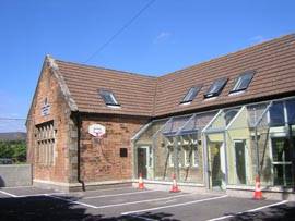 A view of the side of our building, including side access door for people who need to park close to an entrance.